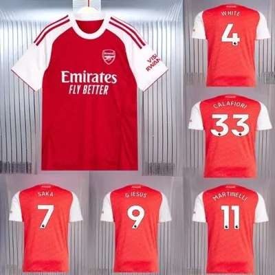 Red and white football shirts arranged in a grid, one full shirt on a hanger beside five squad shirts printed with player names and numbers